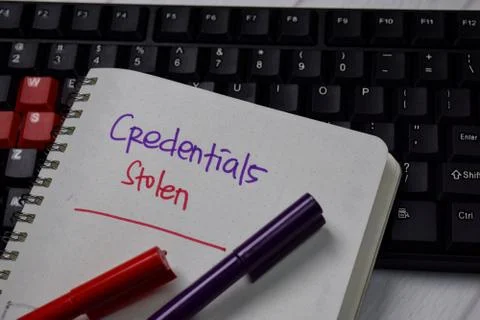 Credentials Stolen write on a book isolated on keyboard computer Stock Photos