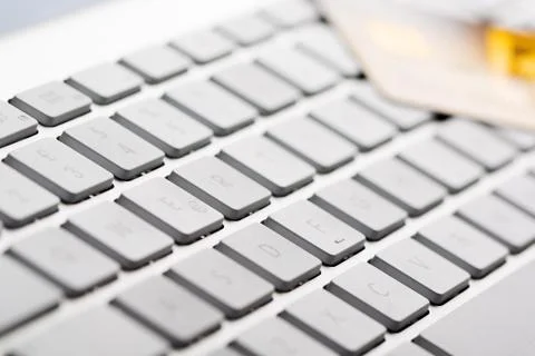 Credit card on a computer keyboard Stock Photos