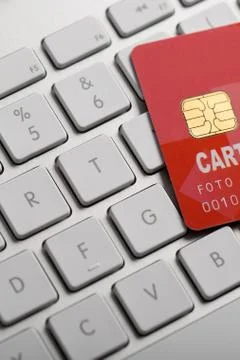 Credit card on a computer keyboard Stock Photos