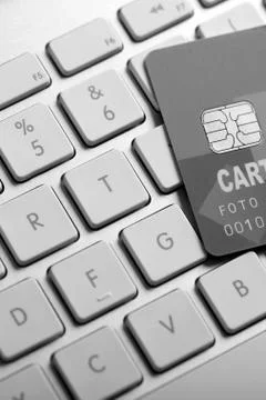Credit card on a computer keyboard Stock Photos