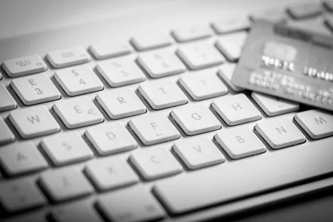 Credit card on a computer keyboard Stock Photos
