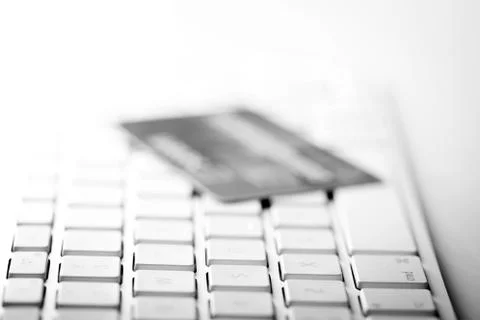 Credit card on a computer keyboard Stock Photos