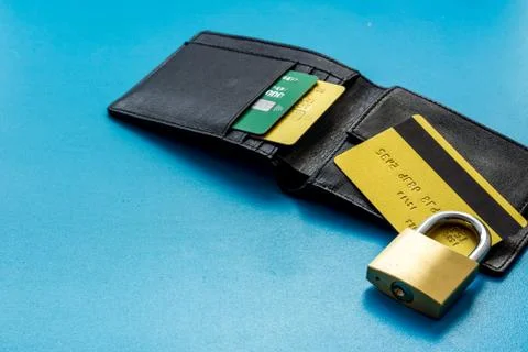 Credit card data security concept with lock on blue table Stock Photos