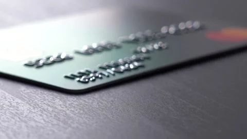 Credit card falls on the table. Macro. 動画素材 154841335