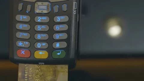 Credit card machine chip and pin code being entered by a man POV. A detail Видео 107601540