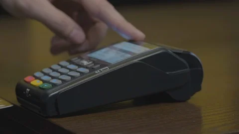 Credit card machine chip and pin code being entered by a man POV. A detail Stock Footage 107616391