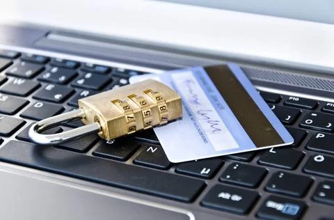Credit card with padlock lying on computer keyboard symbolizing secure onl... Foto stock