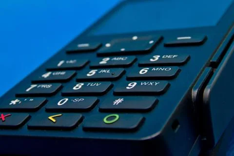 Credit card reader on a blue background close up Stock Photos