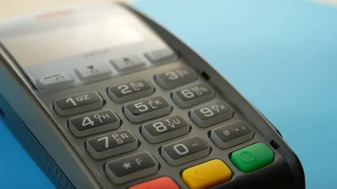 Credit card reader machine at bar counter with male holding credit card Stock Footage 96443559