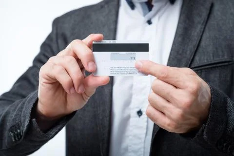 Credit card security secret code number man hold Stock Photos