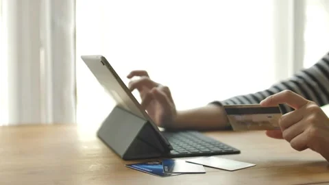 Credit card using instant mobile payments at home laptop or couple with credi Stock Footage 265933556