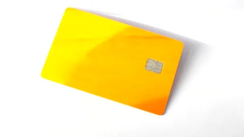 Credit card on a white surface, highlighting simplicity and elegance in fin.. Stock Footage 260823236