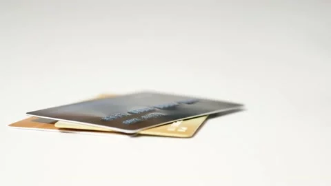 Credit cards stacked on white table Stock Footage 239659816