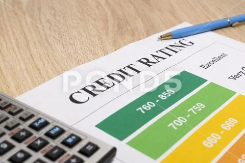 Credit rating chart with pen and calculator. Stock Photos
