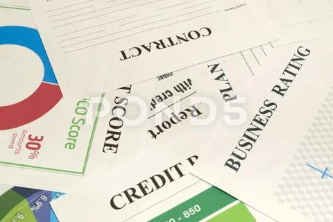 Credit score, report, rating and contract on the table. Stock Photos