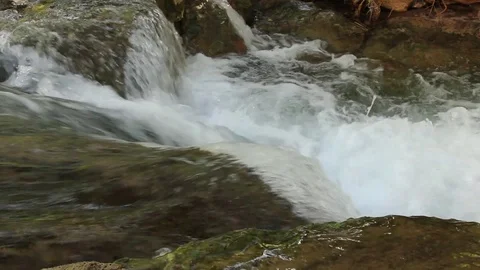 Creek Flowing Down through Stones Stock Footage 78021177