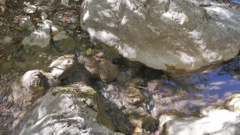 Creek flowing over the rocks Stock Footage 69904526