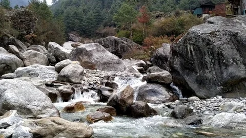 Creek flows in a mountainous area Stock Footage 125388756