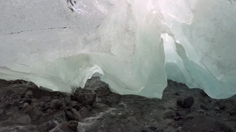 Creek flows out from under the glacier. Video stock 126098902