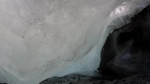 Creek flows out from under the glacier. Stock Footage 126098983
