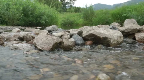 Creek running through rocks Stock Footage 44089521