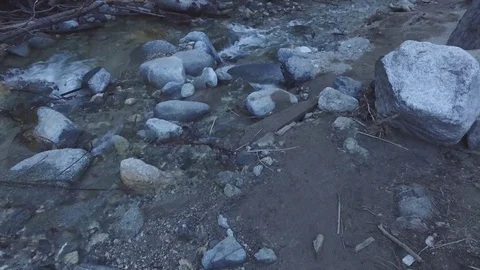 Creek with water flowing down stream 動画素材 73436910
