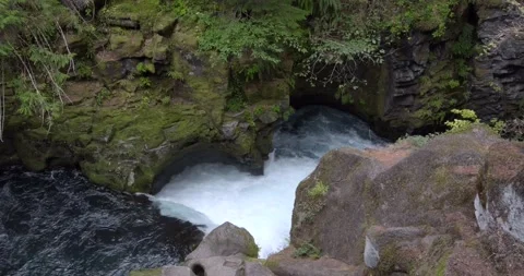 Creek water streaming down narrow gorge - 4K Nature Stock Footage 220168491