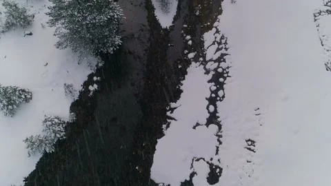 Creek in winter time Brook stream sky reflecting on water snow cold Stock Footage 163651512