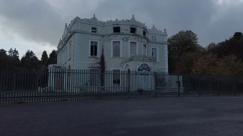 Creepy abandoned hotel, crumbling ruins; Hope Castle, Castleblayney Stock Footage