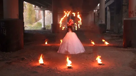 Creepy bride with makeup on her face holding burning torches. Halloween. Stock Footage 112339272