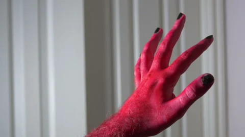 Creepy devil hand weird Stock Footage 63928014