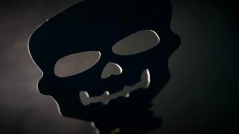 Creepy face appears on dark smoke background Stock Photos