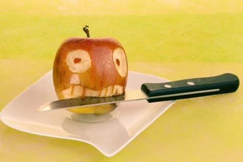 Creepy face in apple Stock Photos