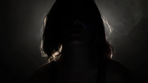 Creepy figure leans back Stock Footage 121435602