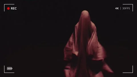 Creepy ghost figure captured in eerie night footage with 4K REC overlay. Stock Footage 318782003