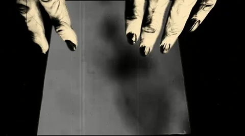 Creepy hands opening a book of spells Stock Footage 173376522