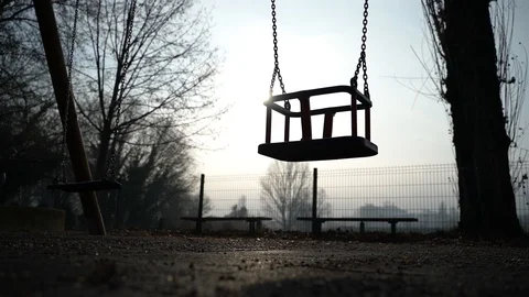 Creepy image of child swing moving alone at misty day, Zagreb, Croatia. Stock Footage 105502686