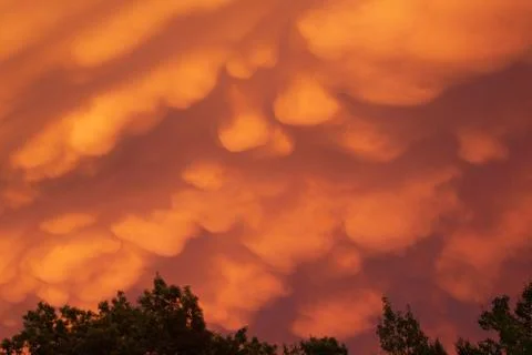 Creepy orange clouds Stock Photos