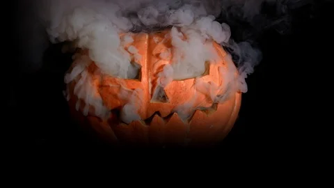 Creepy pumpkin jack-o-lantern face. Everything in the smoke Stock Footage 116894834