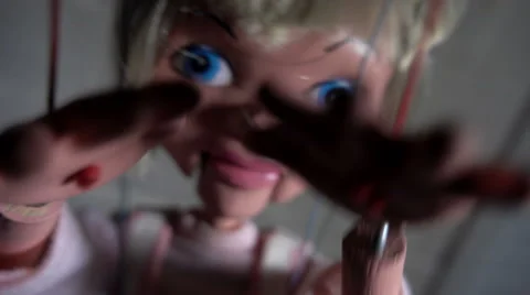 Creepy puppet reaches to camera Stock Footage 55777359