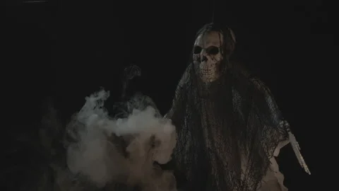 Creepy Skeleton In Front of Steaming Boiling Cauldron In Slow-Mo Stock Footage 138538463