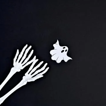 Creepy skeleton hands with ghost on dark black background. Halloween copy spa Stock Illustration
