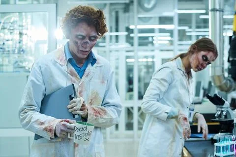 Creepy Walking Dead At Work In Lab Stock Photos