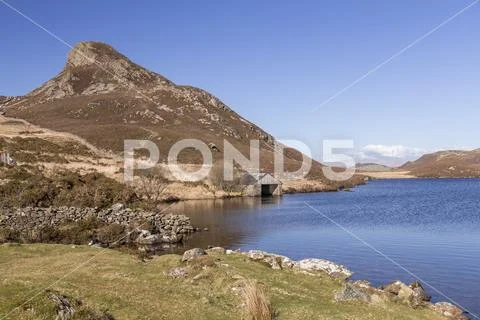 Cregennan Lakes boathouse, Snowdonia, Wales, on a clear, sunny day Stock Photos