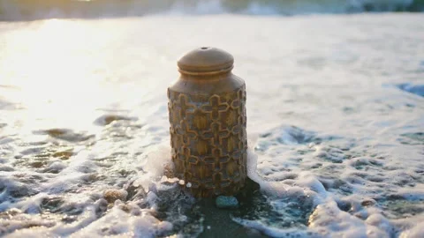 Cremation urn on the ocean coast close-up ,no body Stock Footage 246745635
