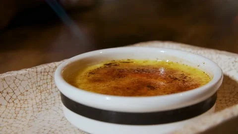 Creme brulee dessert in flames Stock Footage 143635562