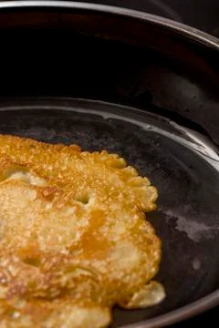Crepe baking in pan Stock Photos