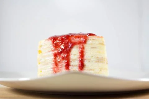 Crepe Cake with strawberry source Foto stock