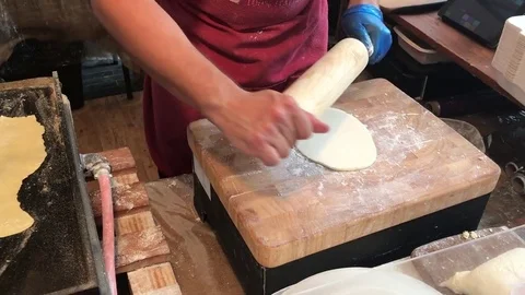 Crepe dough rolling Stock Footage 81870600