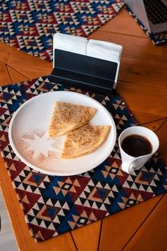 Crepes and Coffee on Patterned Tablecloth Stock Photos